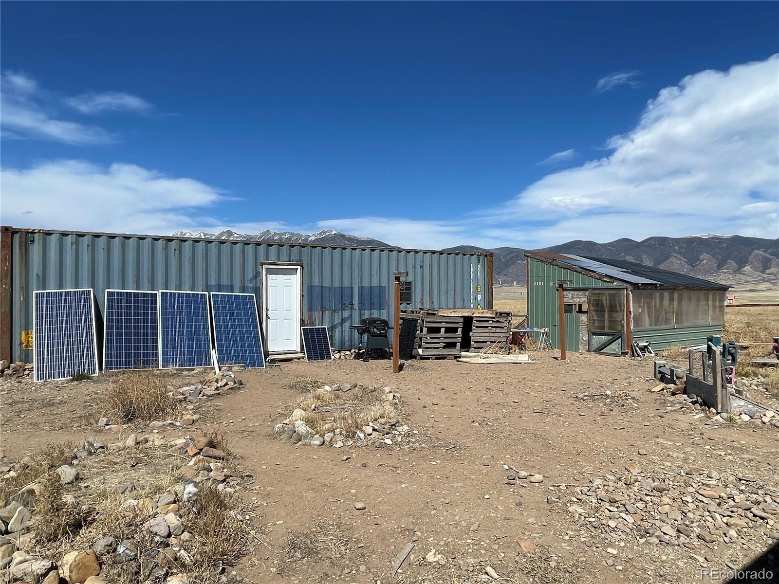58313 County Road Villa Grove, CO 81155 - Photo 18 of 39 a view of a house with a patio
