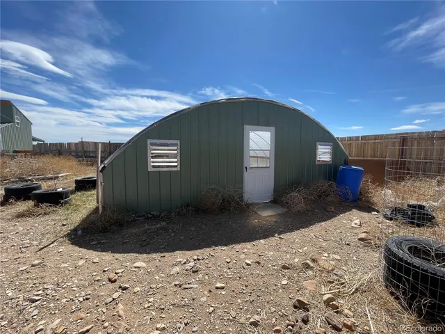 a view of a backyard of a house