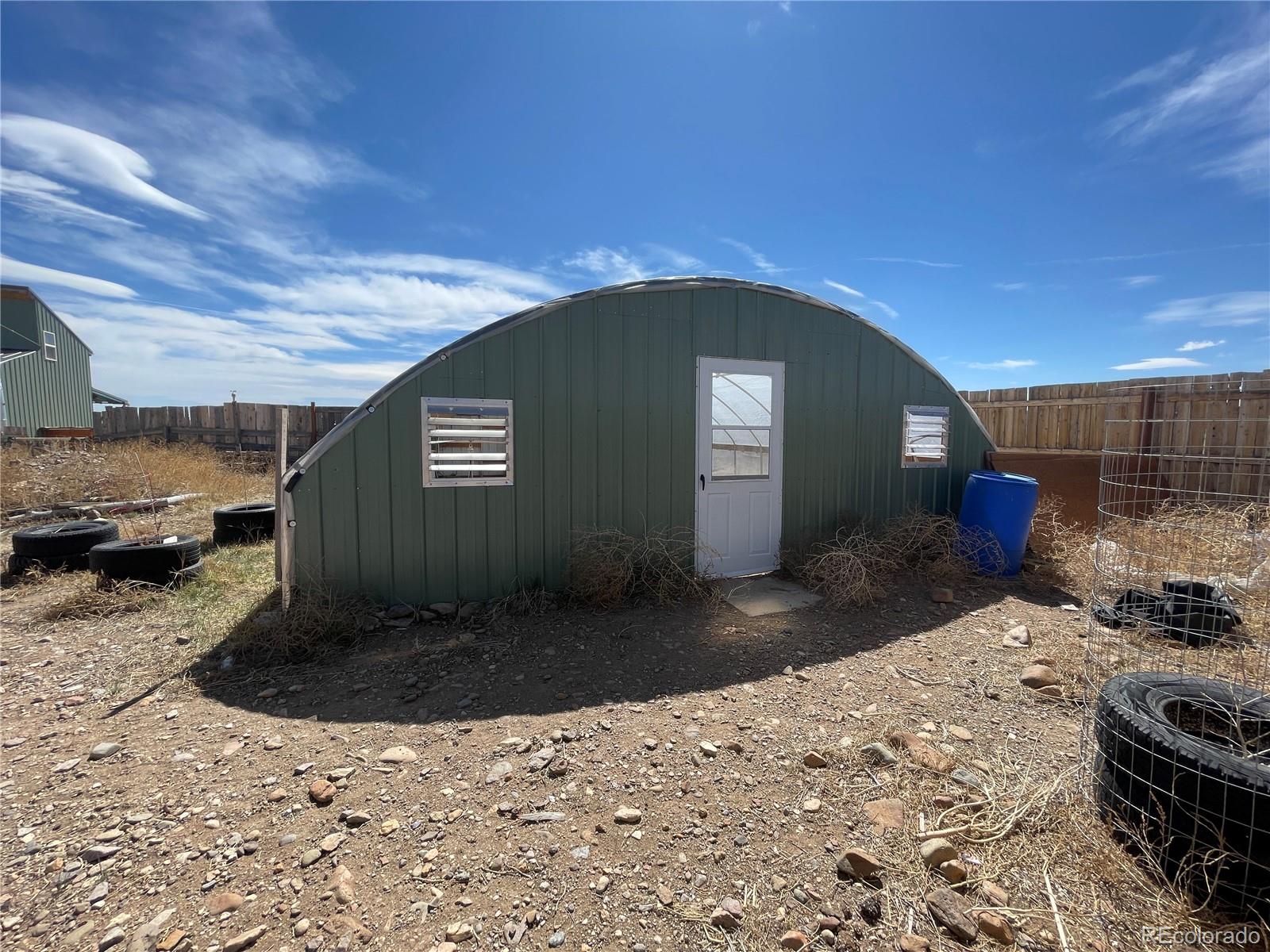 58313 County Road Villa Grove, CO 81155 - Photo 23 of 39 a view of a backyard of a house