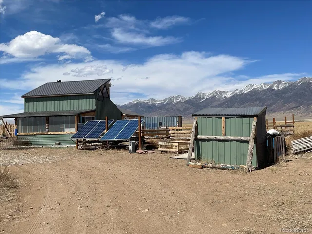 a view of a house with roof and sitting area
