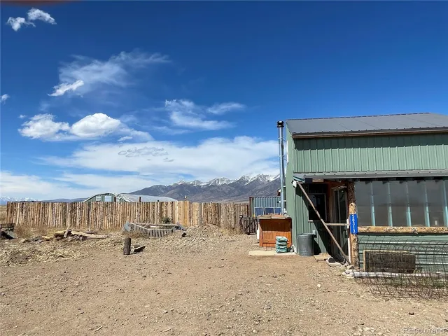 a view of roof deck with a flat tv screen and outdoor seating