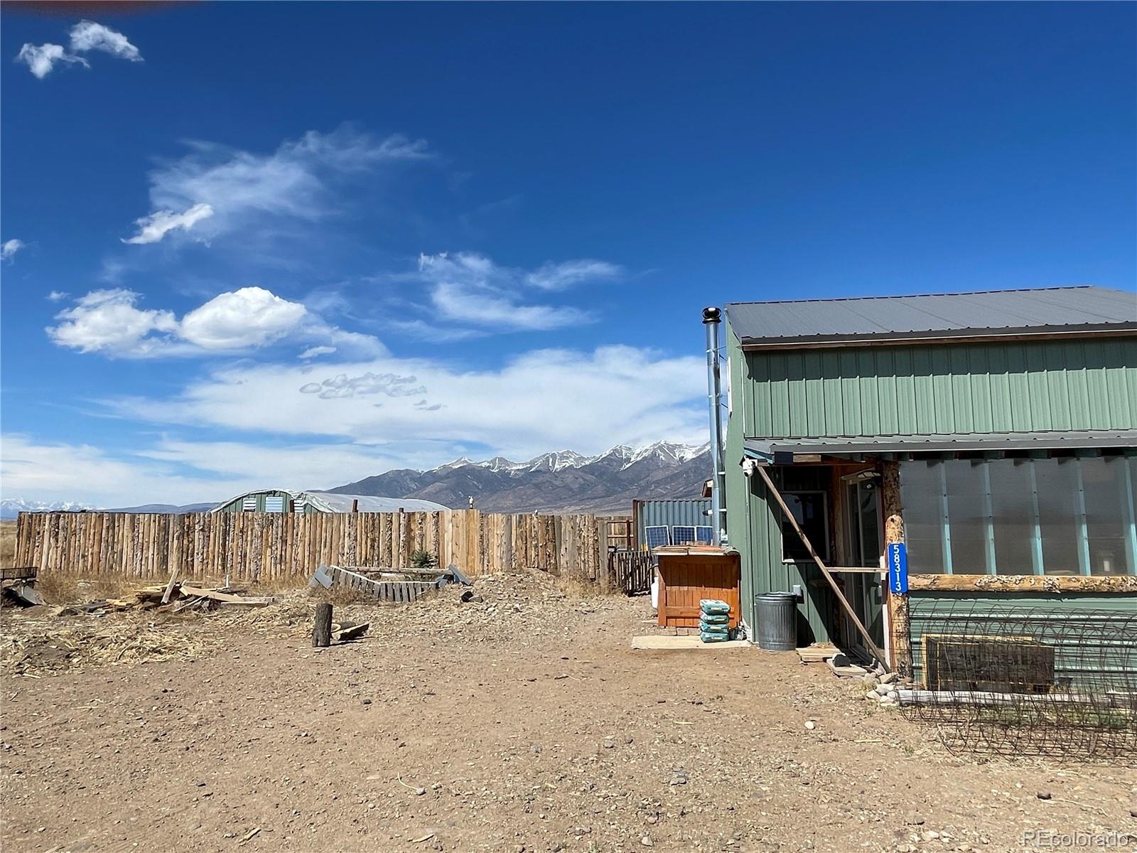 58313 County Road Villa Grove, CO 81155 - Photo 29 of 39 a view of roof deck with a flat tv screen and outdoor seating