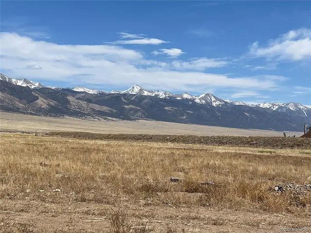 a view of an ocean and a mountain