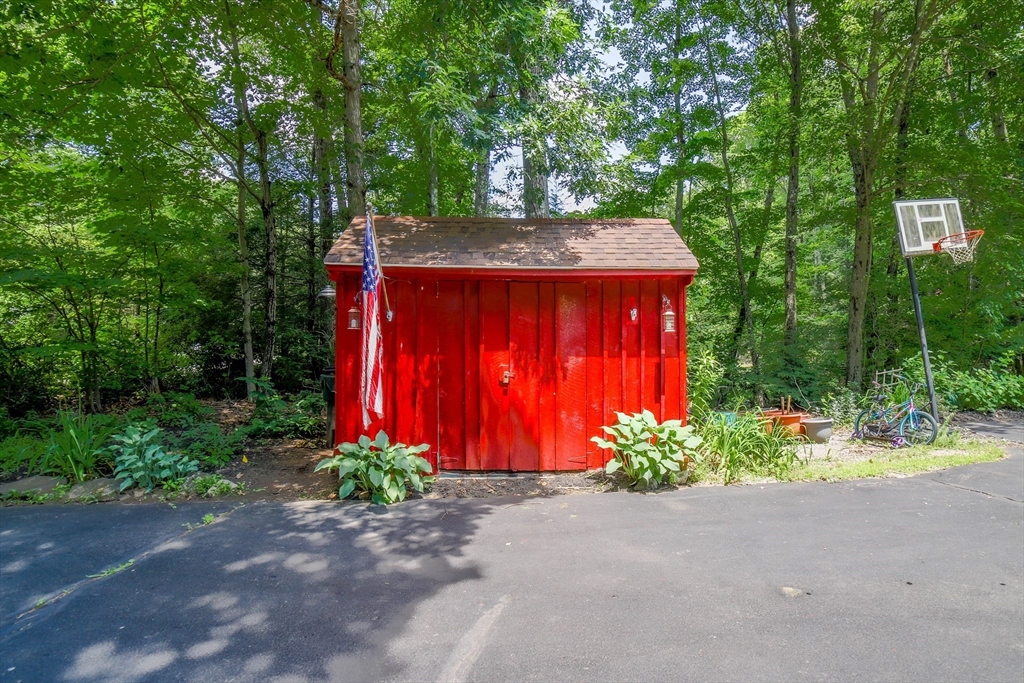 161 Stafford Road Holland, MA 01521 - Photo 32 of 33 a front view of house with yard and trees