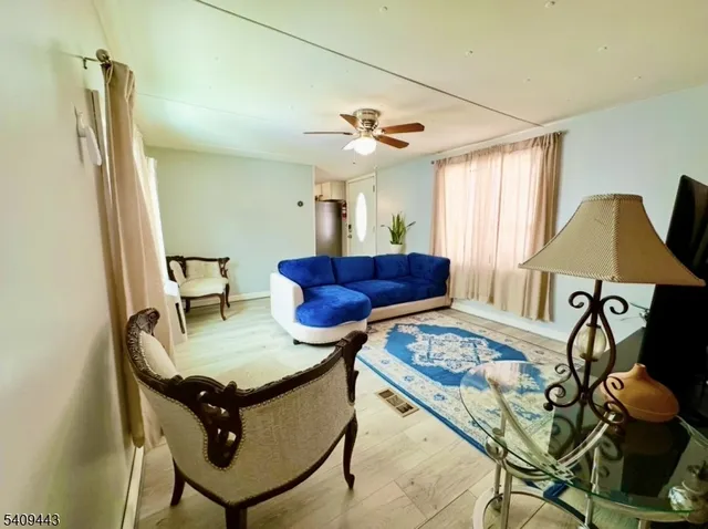 a view of a livingroom with furniture and a table