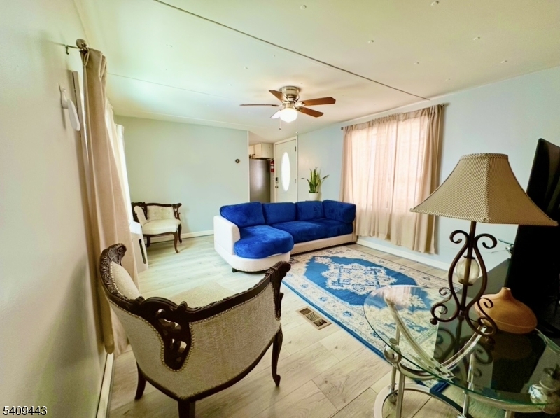 26 Dalbert Street Carteret, NJ 07008 - Photo 11 of 34 a view of a livingroom with furniture and a table