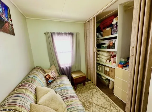 a living room with furniture and a gate