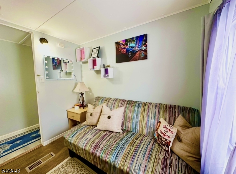 26 Dalbert Street Carteret, NJ 07008 - Photo 16 of 34 a bedroom with a bed and a window