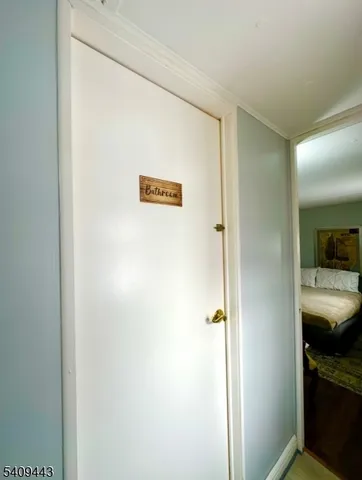 a view of bathroom from a hallway