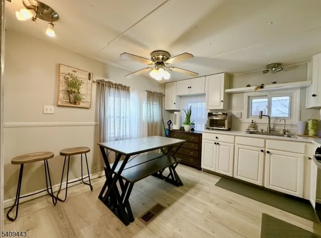 a view of a kitchen and dining room