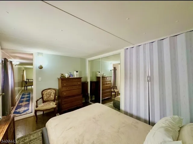 a bedroom with a bed and furniture