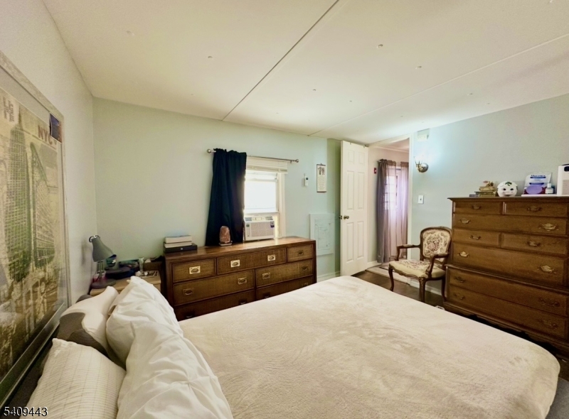 26 Dalbert Street Carteret, NJ 07008 - Photo 23 of 34 a bedroom with a bed and a dresser