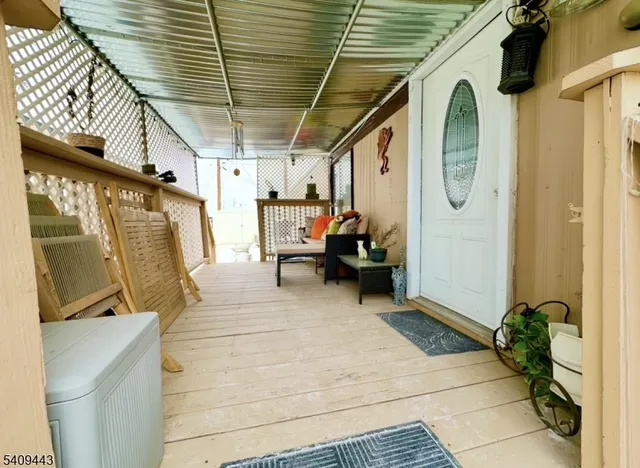 a view of a porch with furniture