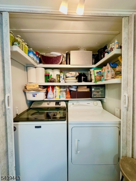 26 Dalbert Street Carteret, NJ 07008 - Photo 8 of 34 a utility room with dryer and washer
