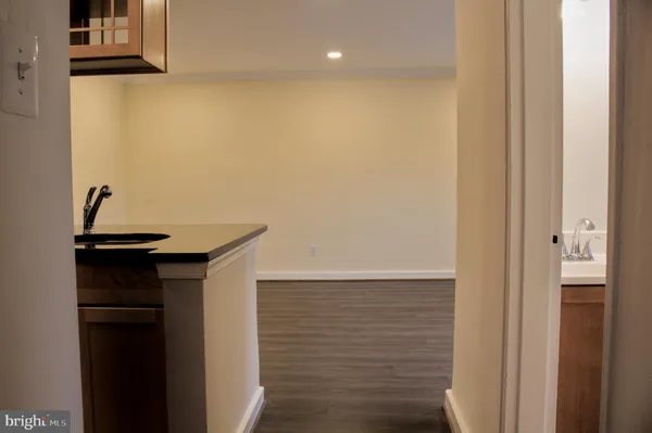 a view of storage and utility room with closet