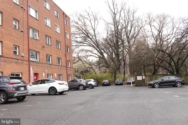 a view of cars parked in front of a building
