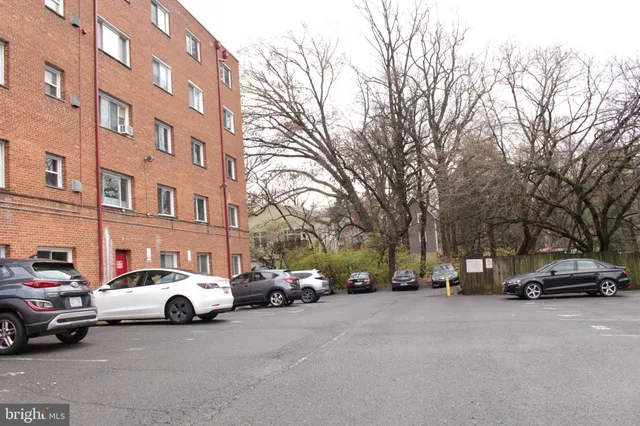 a view of cars parked in front of a building