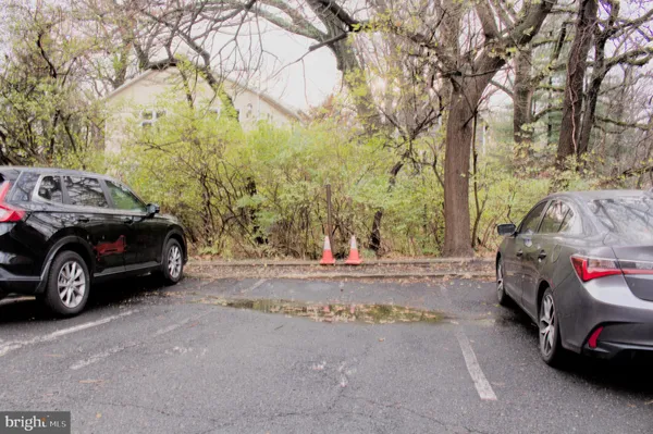 a view of a cars parked in front of a house