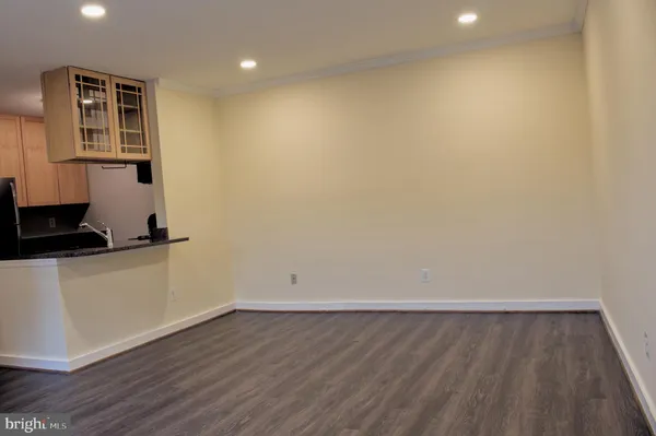 a view of storage and utility room with wooden floor