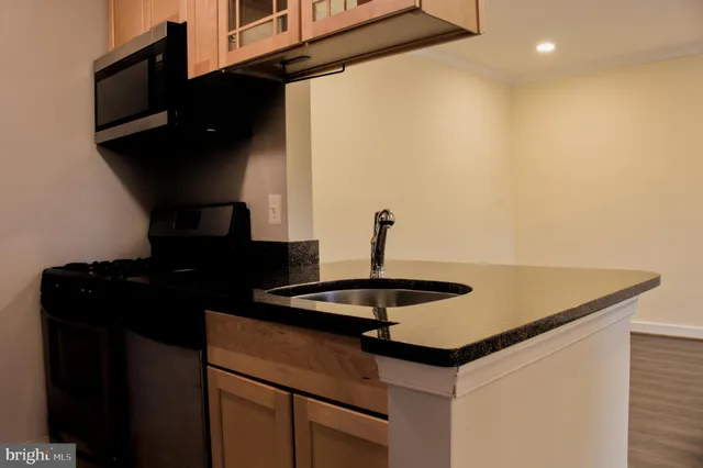 a kitchen with a sink and cabinets