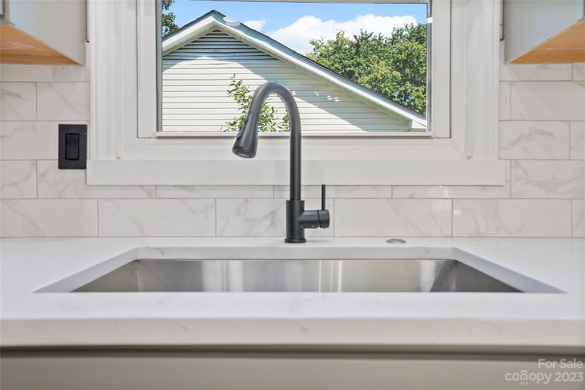 1424 Echo Glen Road Charlotte, NC 28213 - Photo 12 of 26 a view of a kitchen sink with a window