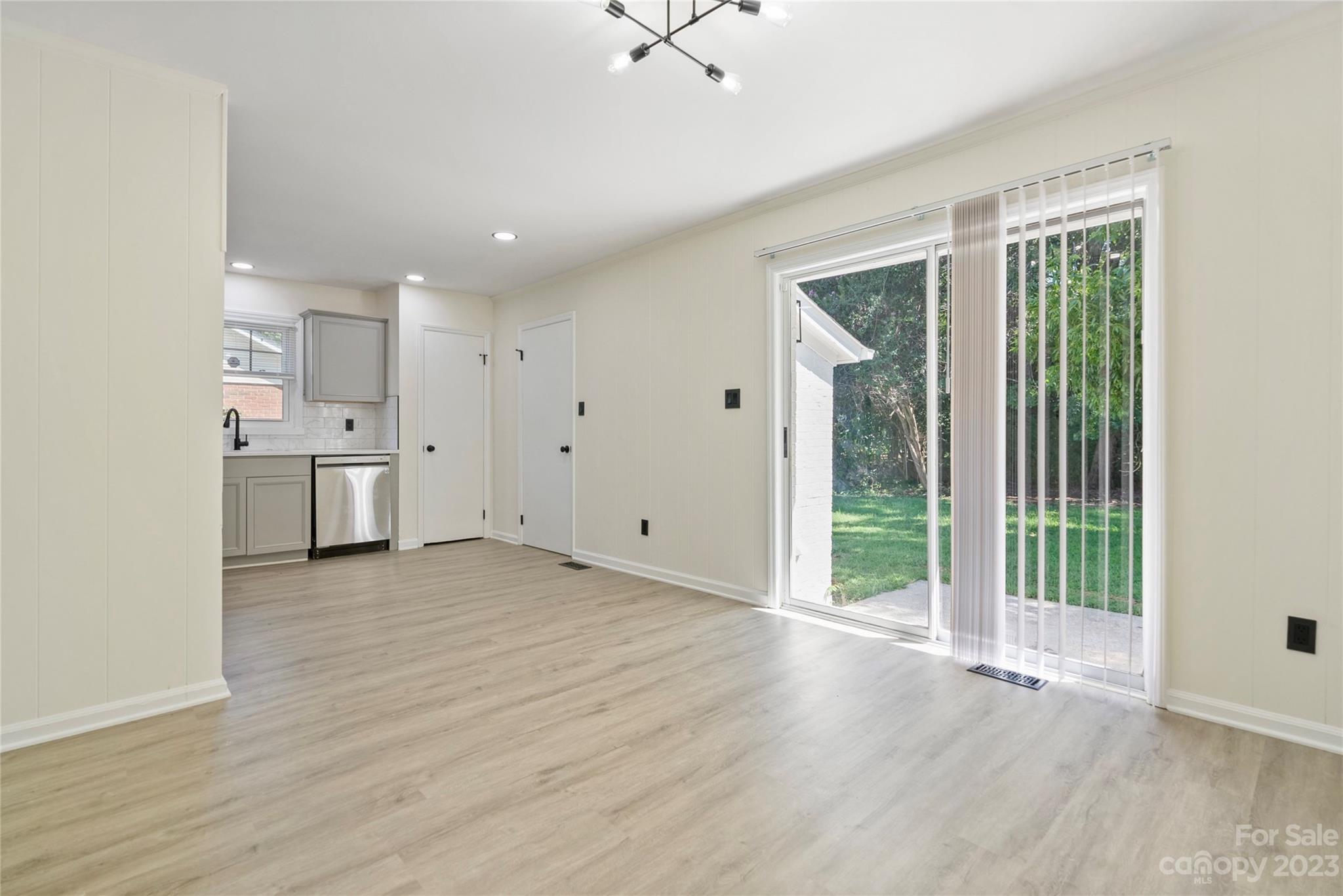1424 Echo Glen Road Charlotte, NC 28213 - Photo 14 of 26 a view of empty room with wooden floor and fan