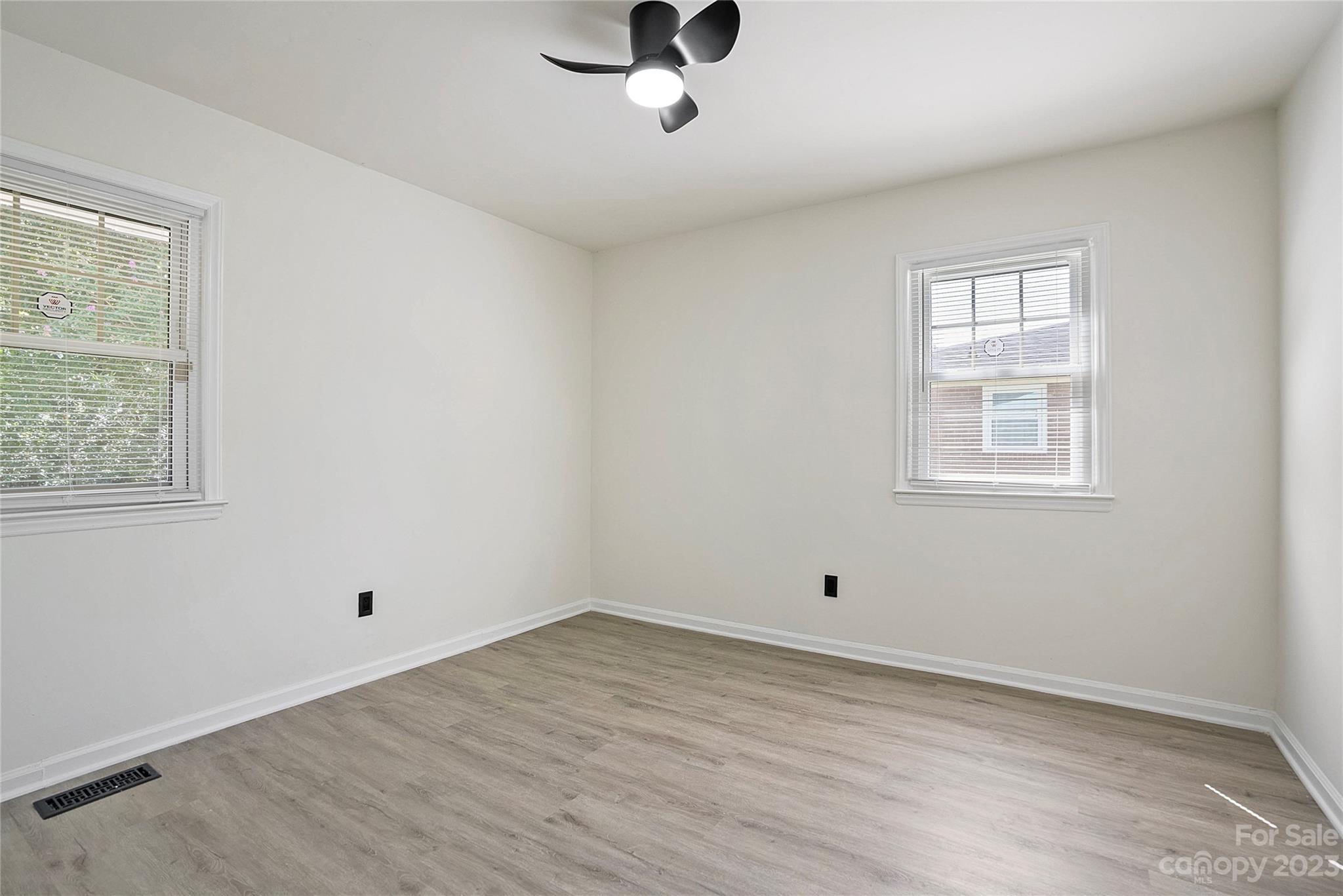 1424 Echo Glen Road Charlotte, NC 28213 - Photo 23 of 26 a view of a room with wooden floor and windows