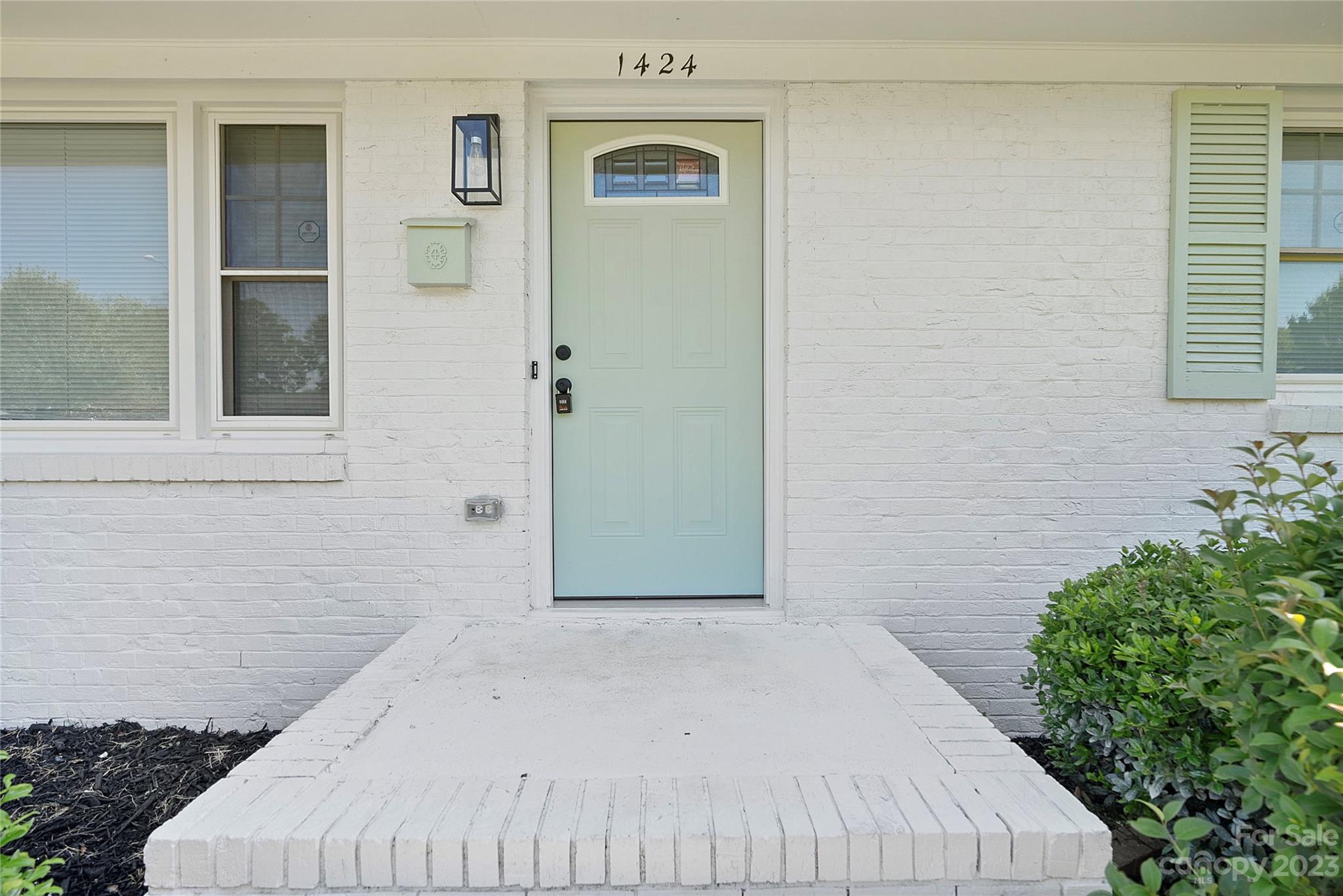 1424 Echo Glen Road Charlotte, NC 28213 - Photo 5 of 26 a bedroom with a bed and a potted plant