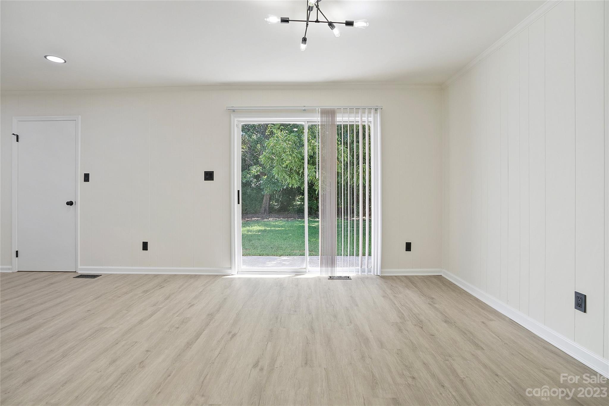 1424 Echo Glen Road Charlotte, NC 28213 - Photo 9 of 26 wooden floor in an empty room with a window