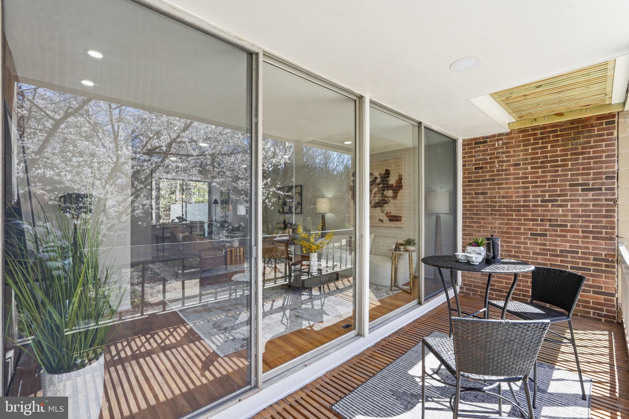 11526 Maple Ridge Road Reston, VA 20190 - Photo 19 of 52 Floor - ceiling glass wall connects indoor/outdoor