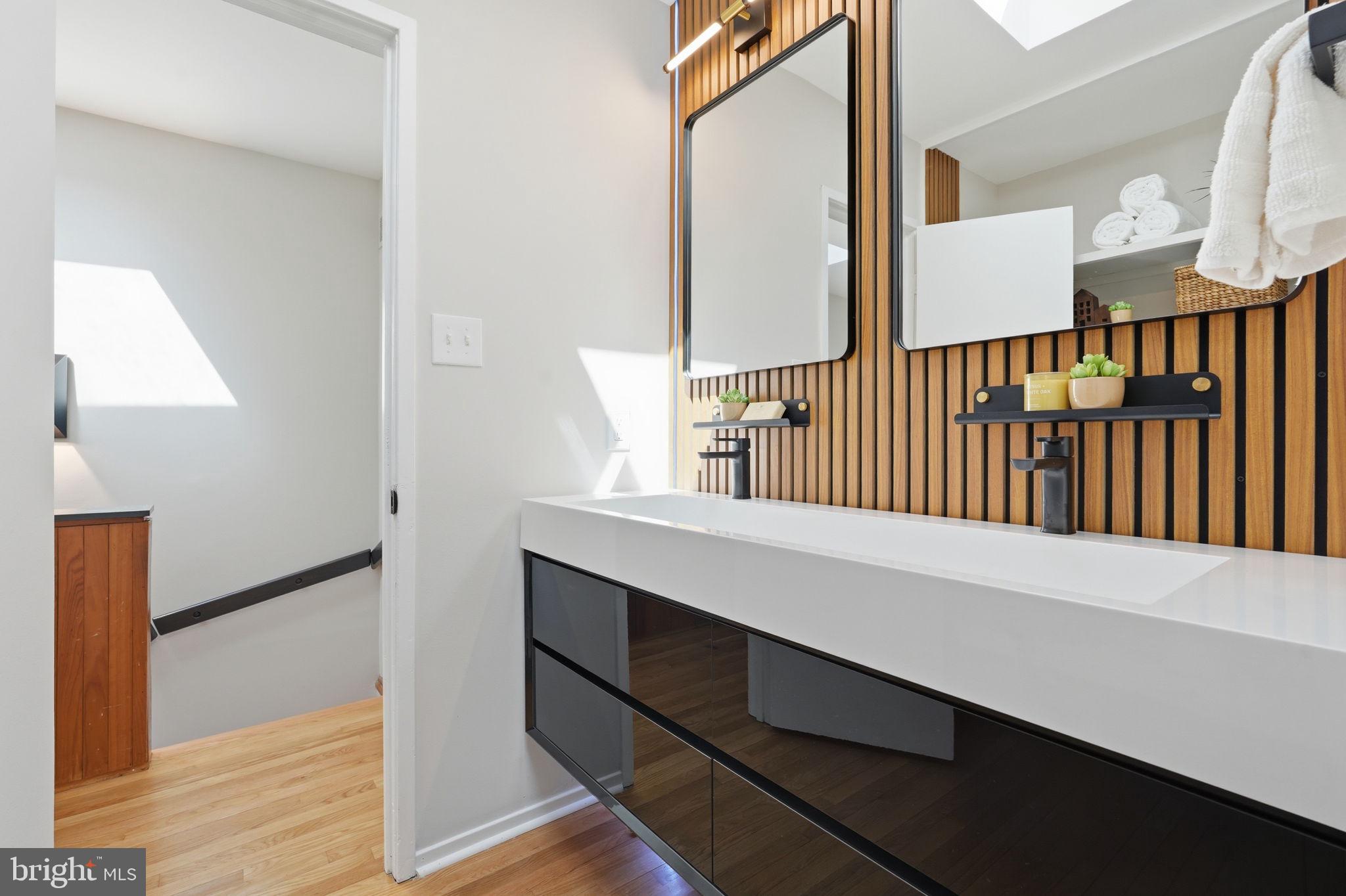 11526 Maple Ridge Road Reston, VA 20190 - Photo 34 of 54 Statement wall adds warmth and texture