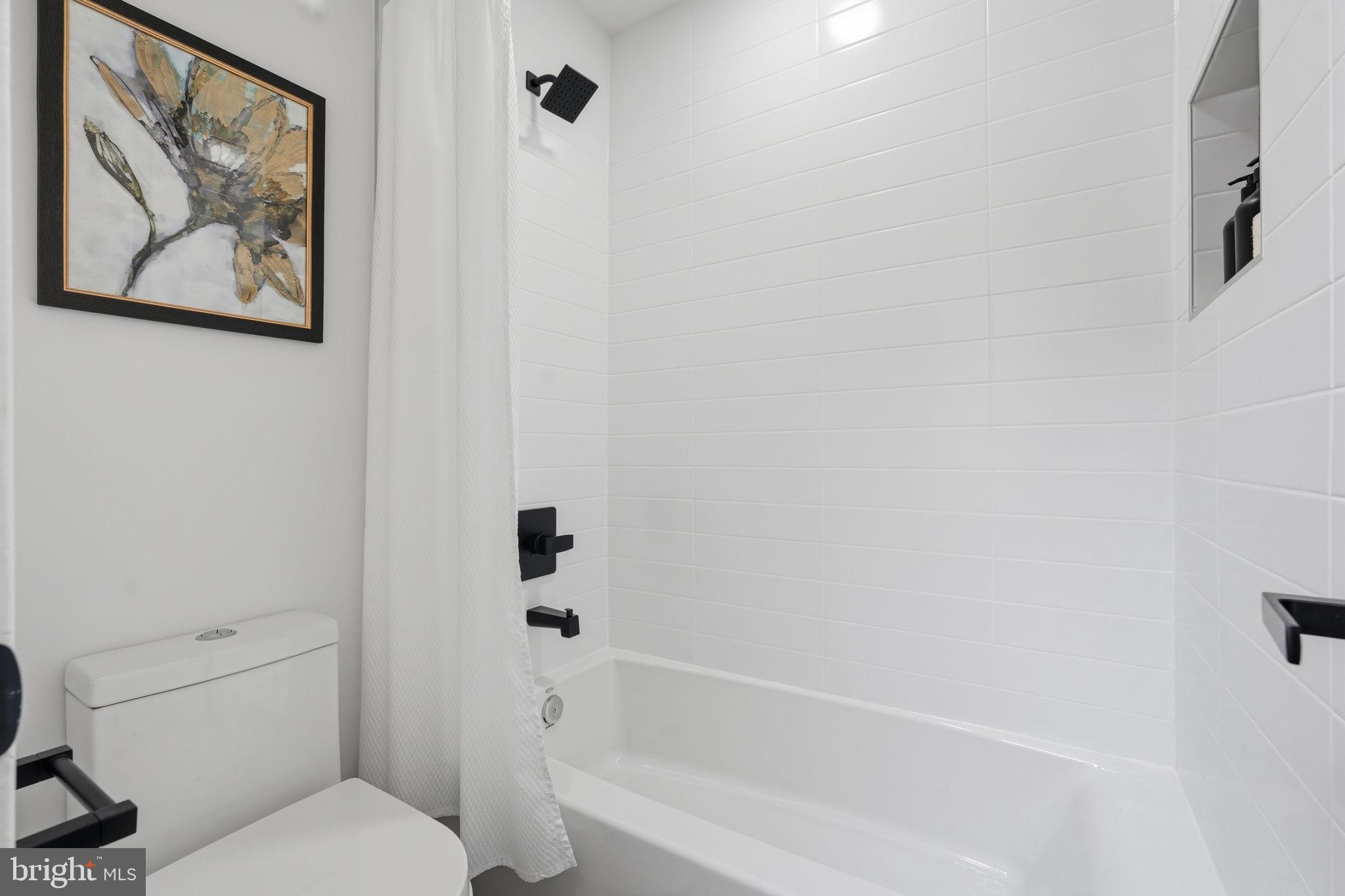 11526 Maple Ridge Road Reston, VA 20190 - Photo 34 of 52 Crisp white tile with bold contrast