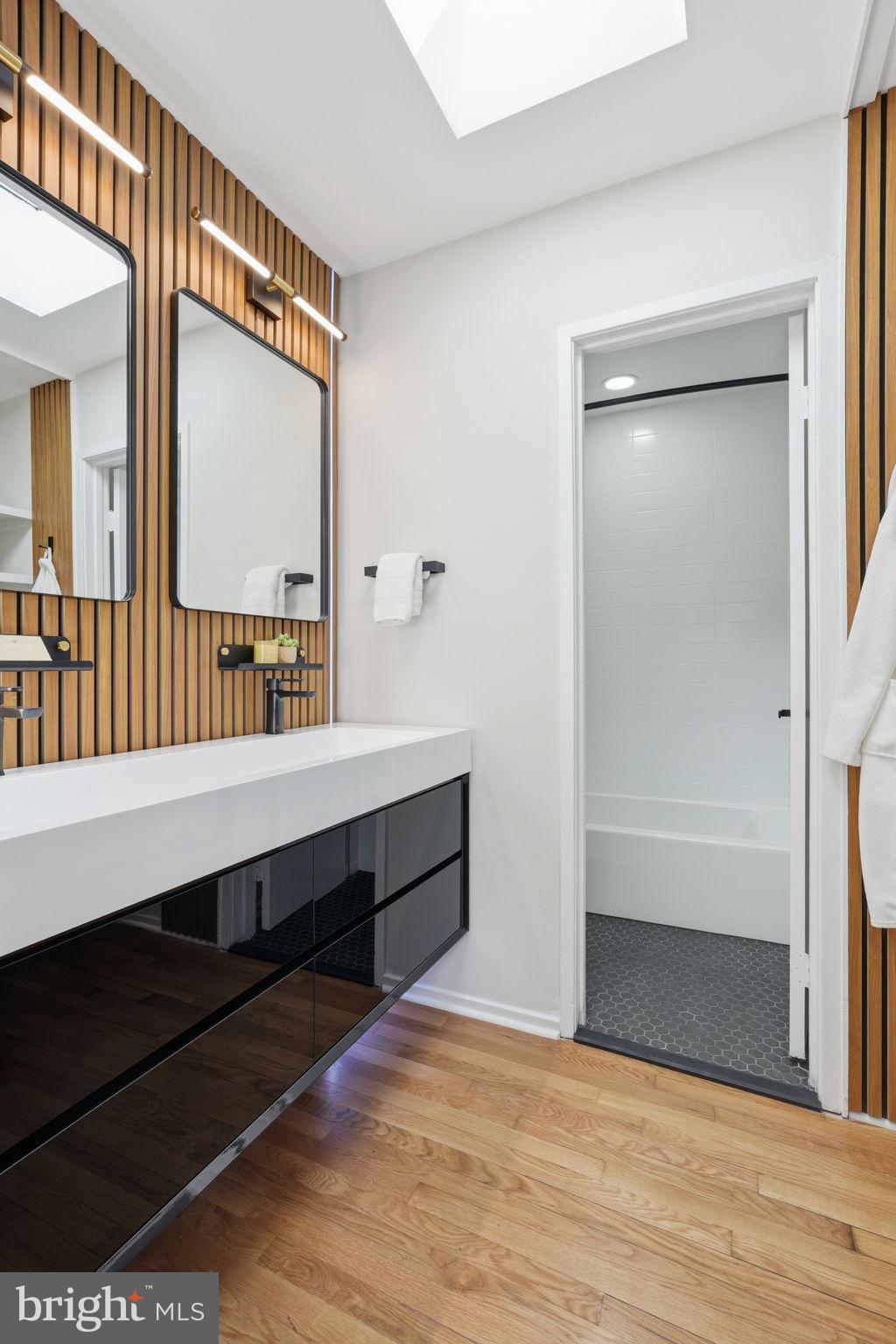 11526 Maple Ridge Road Reston, VA 20190 - Photo 35 of 54 Modern double vanity with wood slat detail