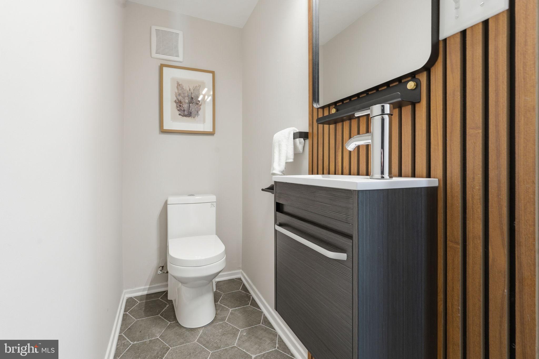11526 Maple Ridge Road Reston, VA 20190 - Photo 10 of 54 Warm wood accents define the powder room