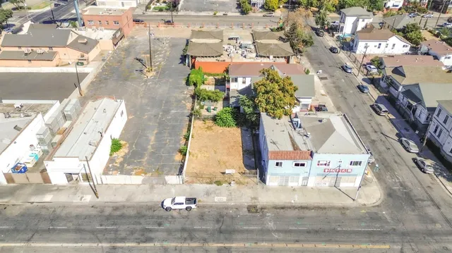an aerial view of residential houses with outdoor space