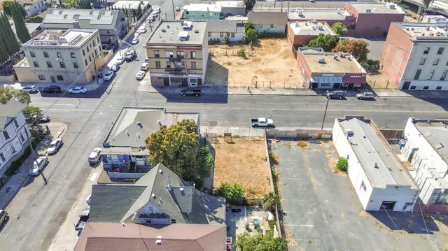 an aerial view of houses with outdoor space