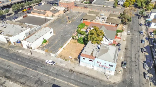 an aerial view of a house with a yard and sitting area