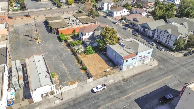 an aerial view of a residential houses with outdoor space