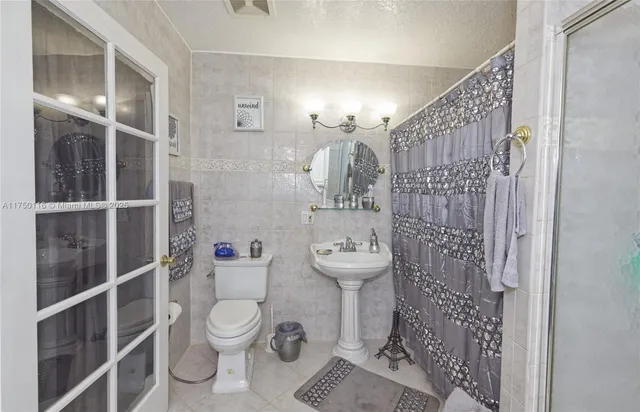 walk in closet with wooden floor