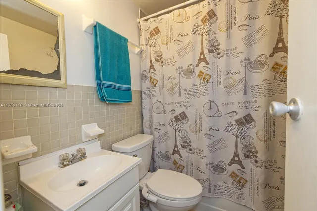 a bedroom with a bed and flat screen tv