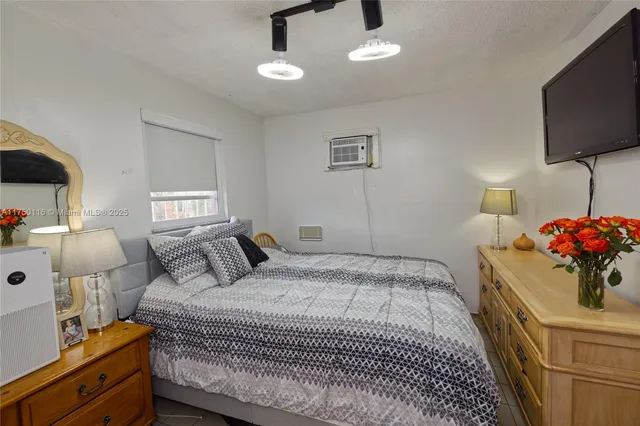 a bed room with a bed and a night stand