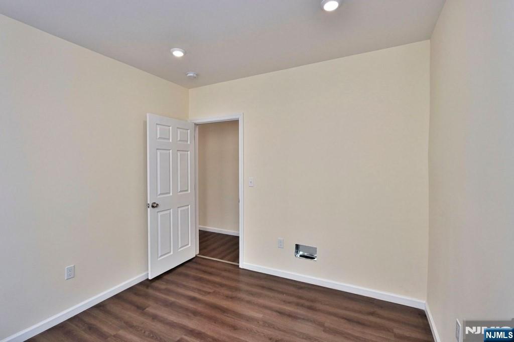 183 Bergen Turnpike Ridgefield Park, NJ 07660 - Photo 4 of 6 a view of an empty room with wooden floor