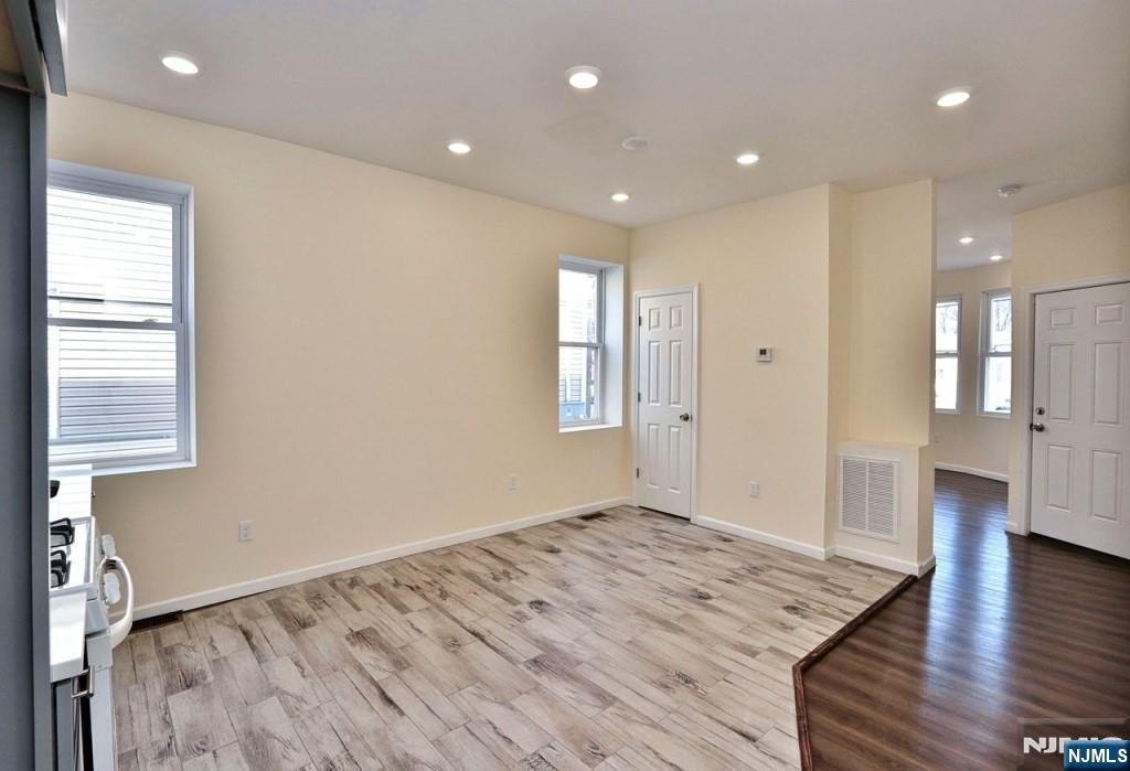 183 Bergen Turnpike Ridgefield Park, NJ 07660 - Photo 6 of 6 a view of an empty room with wooden floor and a window