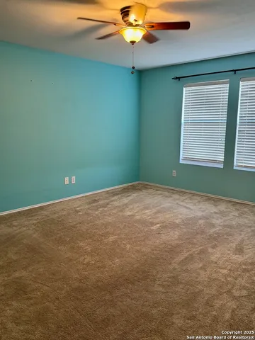 a view of a room that has a fan