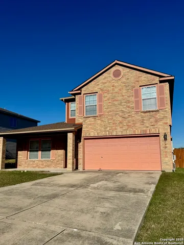 a front view of a house with a garage