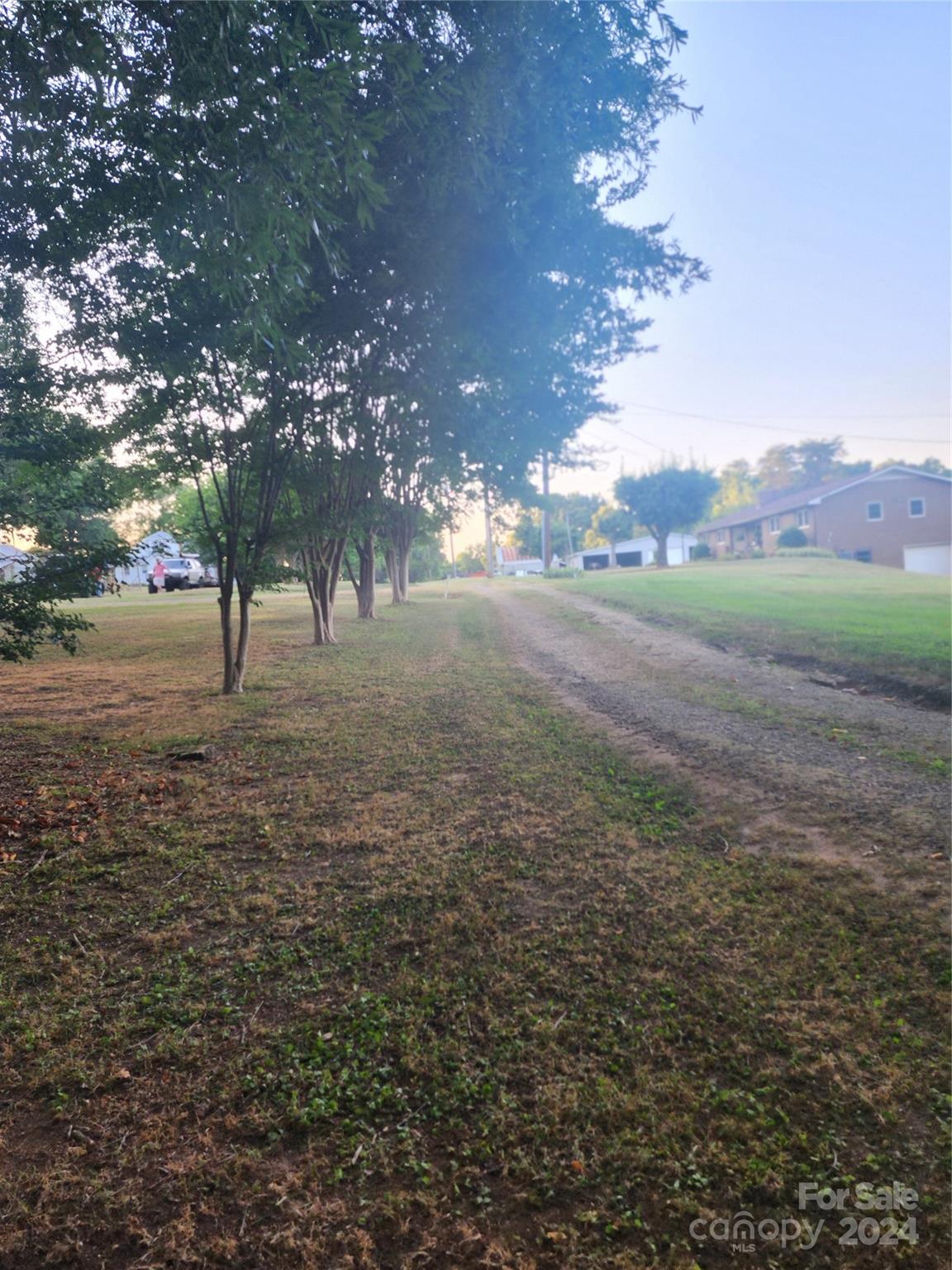 3004 Goble Road Hiddenite, NC 28636 - Photo 14 of 17 a view of dirt yard with a house
