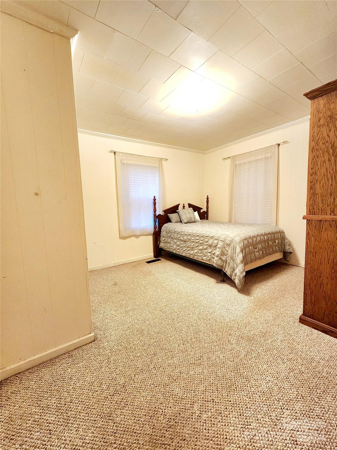 3004 Goble Road Hiddenite, NC 28636 - Photo 9 of 17 a spacious bedroom with a bed and a cabinets