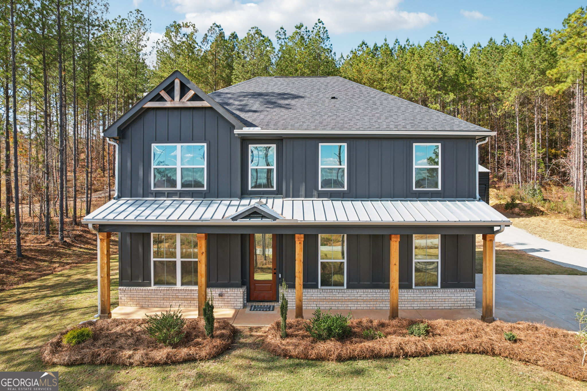 a front view of a house with garden