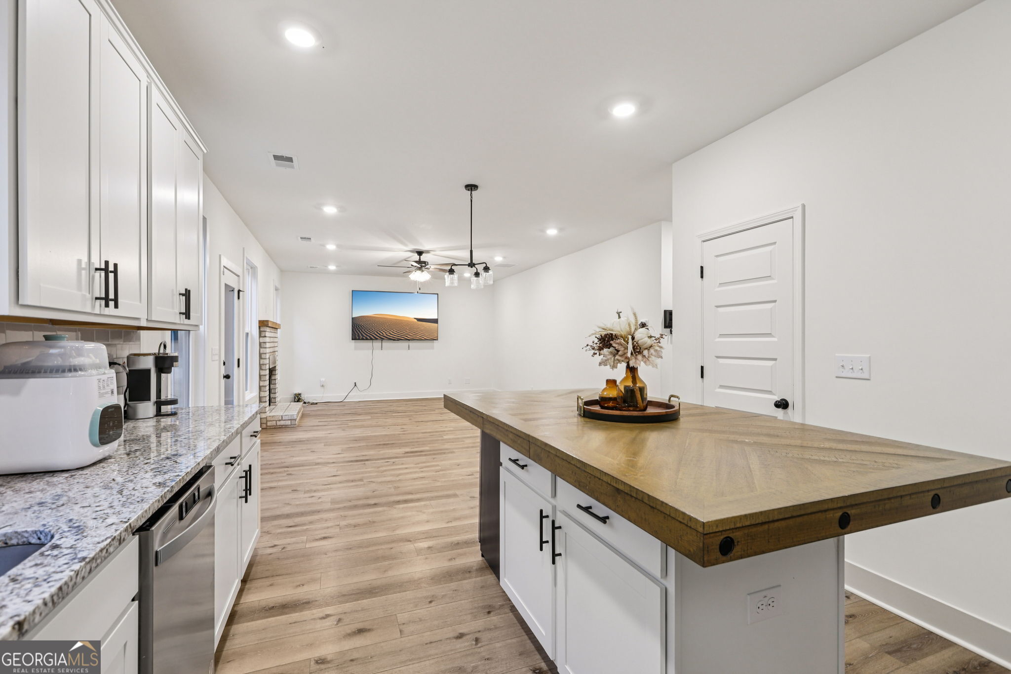 779 Millen Road Monticello, GA 31064 - Photo 17 of 52 a kitchen with granite countertop a sink and cabinets
