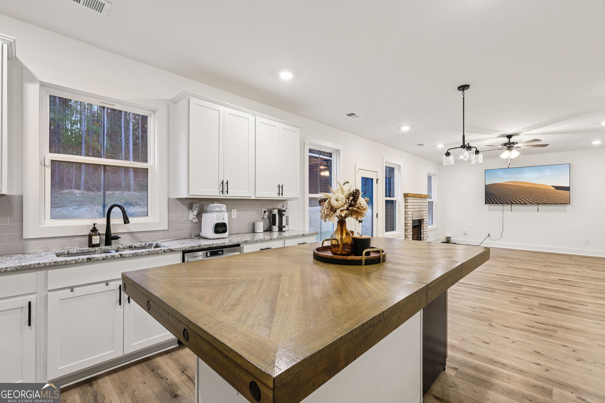 779 Millen Road Monticello, GA 31064 - Photo 18 of 52 a kitchen with a sink a stove and cabinets
